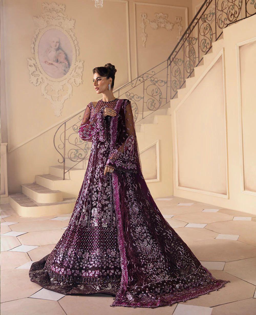 The Pakistani gown in mauve features detailed machine work