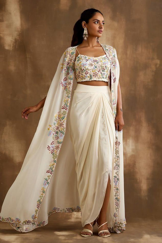 The white Indo-Western dress features vibrant multi-color machine work